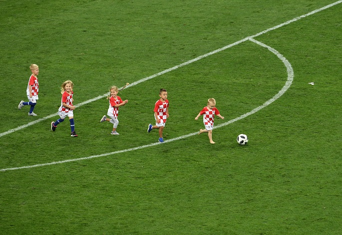 Children of Croatia's players enter into the pitch after the 2018 FIFA World Cup semi-final match between England and Croatia in Moscow, Russia, July 11, 2018. Photo Xinhua by Wang Yuguo.  
