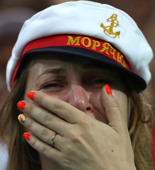 A fan of Russia reacts after the 2018 FIFA World Cup quarter-final match between Russia and Croatia in Sochi, Russia, July 7, 2018. Photo Xinhua by Xu Zijian.  