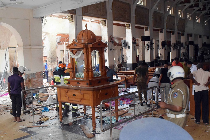 People work at a blast scene at St. Anthony's Church in Kochchikade in Colombo, Sri Lanka, April 21, 2019. Photo Xinhua.