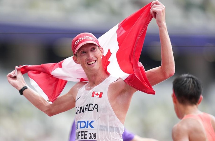 Evan Dunfee of Canada celebrates after winning the men's 35km Race Walk final. Photo: Xinhua.