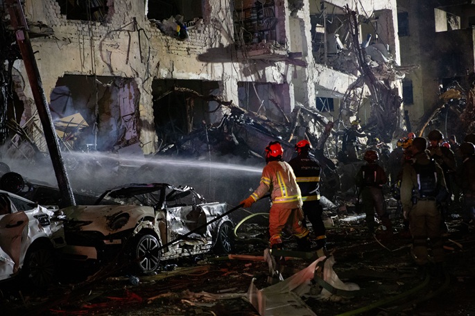 Members of the Israeli security and rescue forces work at the scene where a ballistic missile fired from Iran hit and caused damage in Tel Aviv, Israel, early on March 1, 2026.Photo: Xinhua.