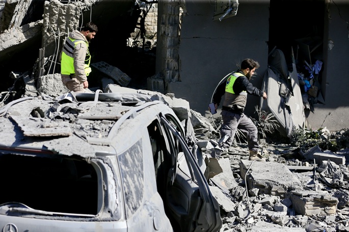 Rescuers inspect buildings and vehicles destroyed in Israeli airstrikes in Saksakiyeh, Lebanon, March 27, 2026. Photo: Xinhua by Ali Hashisho.