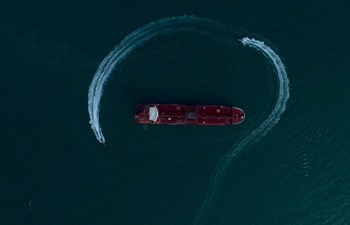 The photo released on July 21, 2019 shows the British oil tanker "Stena Impero" surrounded by Iranian Revolutionary Guard near the Strait of Hormuz, Iran. File Photo: Morteza Akhoundi/ISNA/Handout via Xinhua.