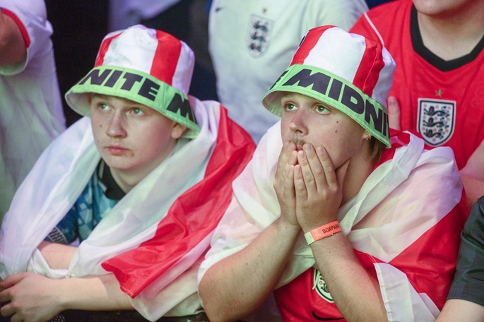 England football fans react while watching the live broadcast of the semifinal at Box Park venue Wembley in London, Britain, July 15, 2026. Photo: Xinhua by Ray Tang.